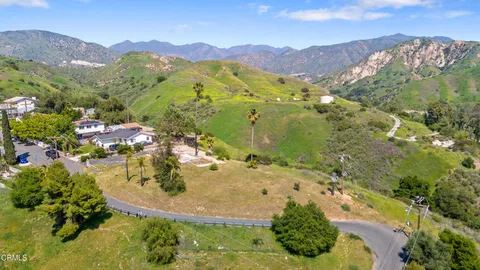 a view of a town with mountains in the background