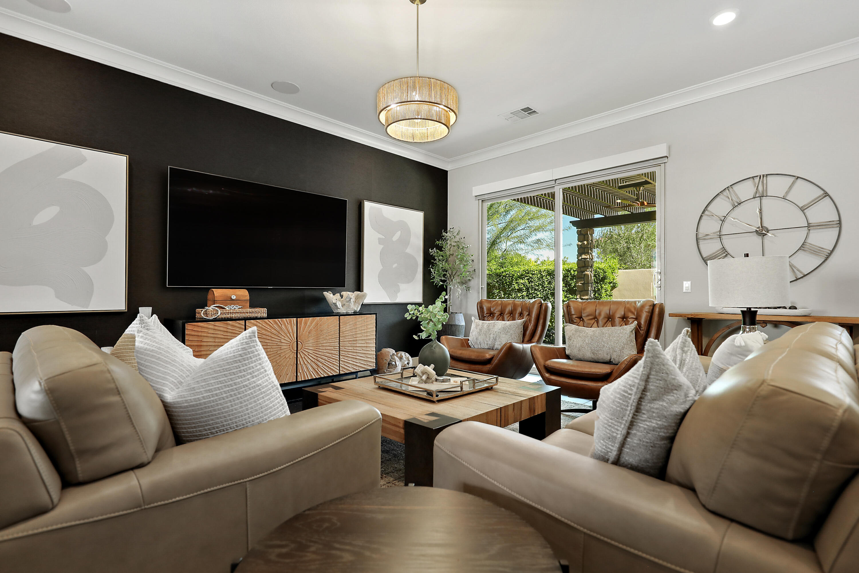 54820 Aristides Court La Quinta, CA 92253 - Photo 16 of 62 a living room with furniture a large window and a flat screen tv