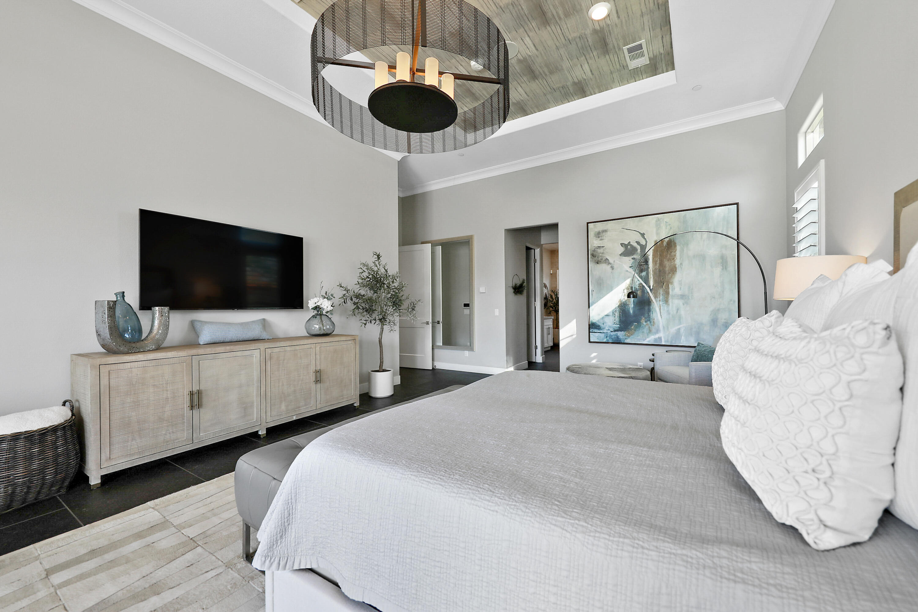 54820 Aristides Court La Quinta, CA 92253 - Photo 19 of 62 a bedroom with a bed window and a flat screen tv