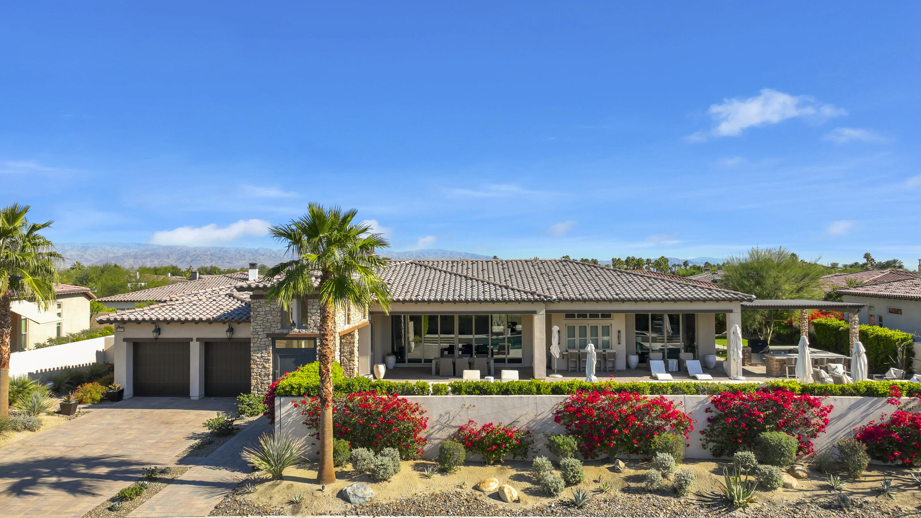 54820 Aristides Court La Quinta, CA 92253 - Photo 2 of 62 a front view of house with yard outdoor seating and barbeque oven