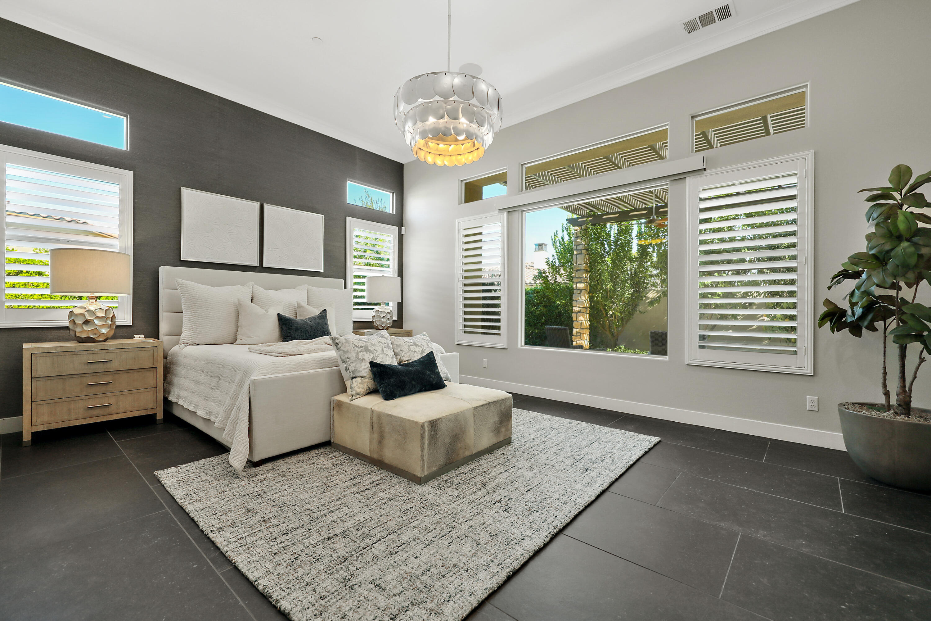 54820 Aristides Court La Quinta, CA 92253 - Photo 27 of 62 a living room with furniture and a chandelier