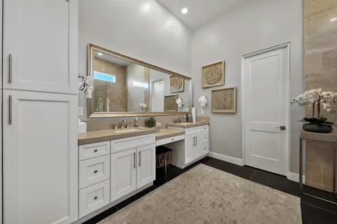 a bathroom with a sink a toilet and a mirror