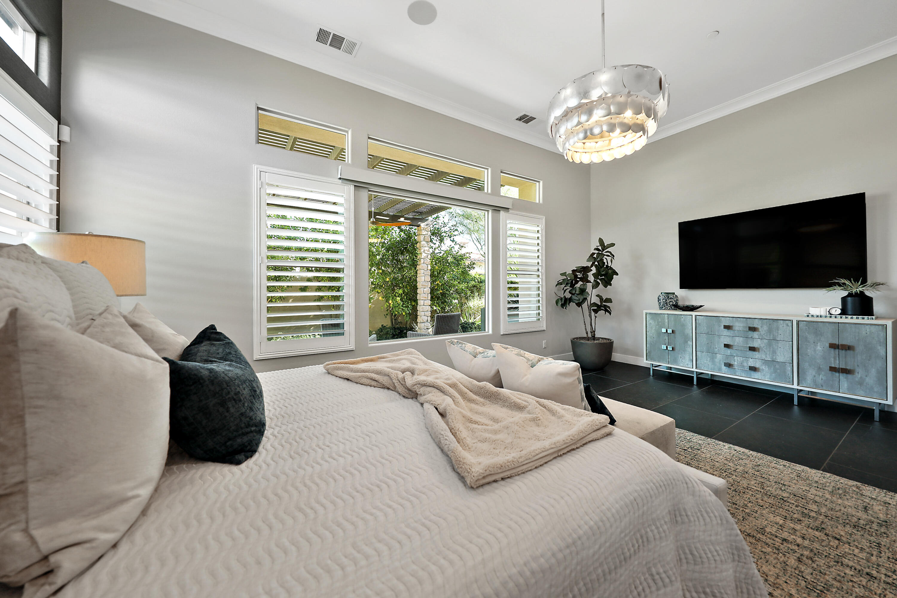 54820 Aristides Court La Quinta, CA 92253 - Photo 30 of 62 a bedroom with bed tv and a window