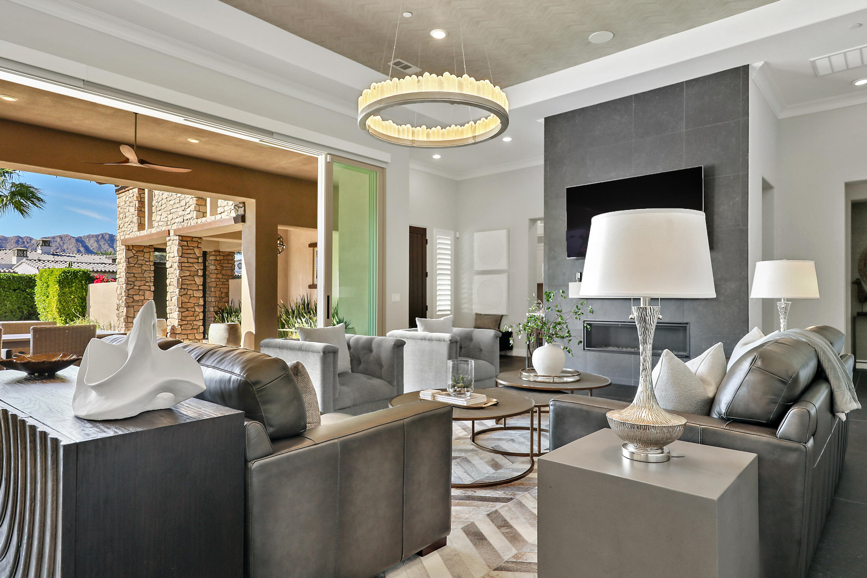 54820 Aristides Court La Quinta, CA 92253 - Photo 9 of 62 a living room with furniture and a large mirror