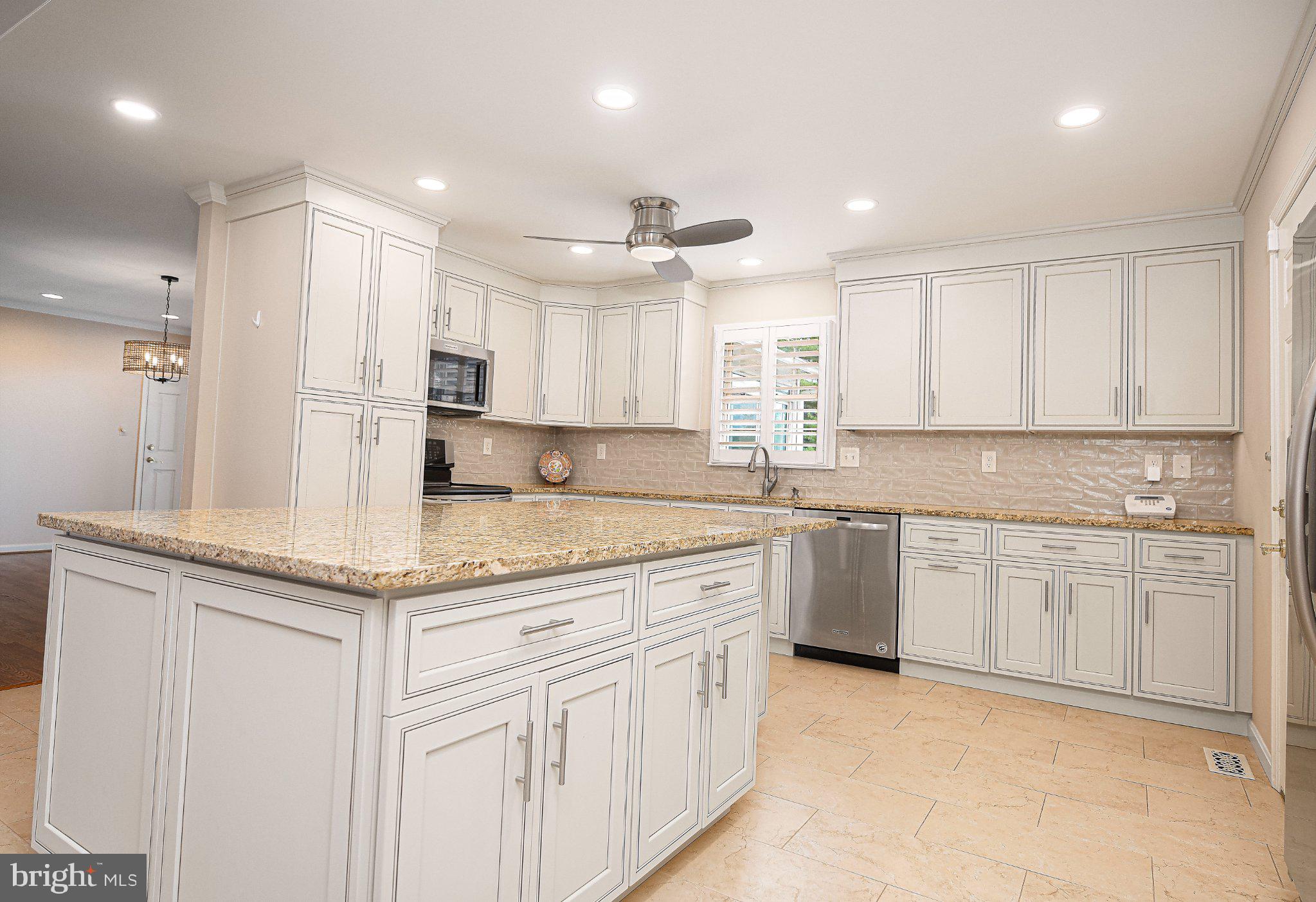 14300 Carroll Ridge Court Baldwin, MD 21013 - Photo 4 of 73 a kitchen with stainless steel appliances granite countertop a sink and cabinets