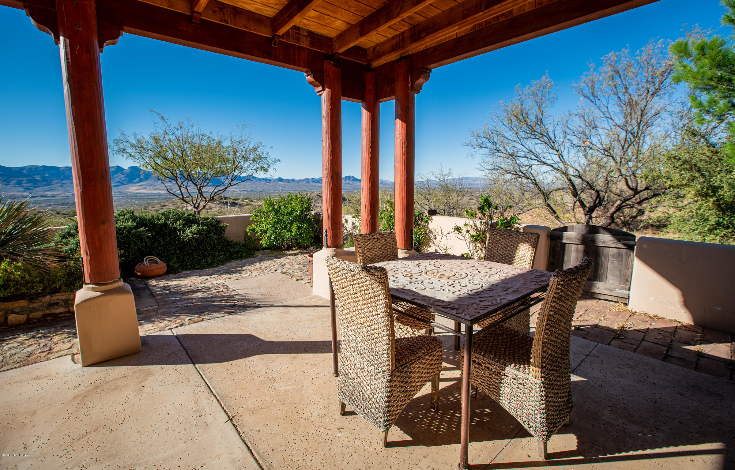 1551 Vía San Cayetano Rio Rico, AZ 85648 - Photo 9 of 29 a view of a patio with a table and chairs
