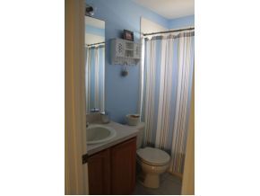 2513 Southern Melbourne, FL 32901 - Photo 6 of 12 a bathroom with a sink and a mirror