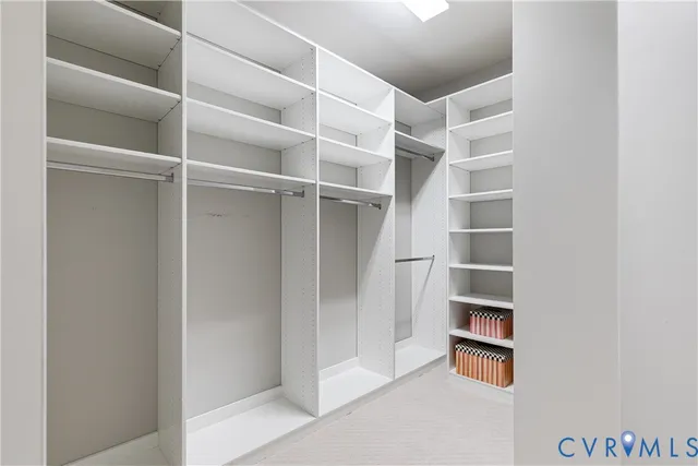 a view of an empty walk in closet