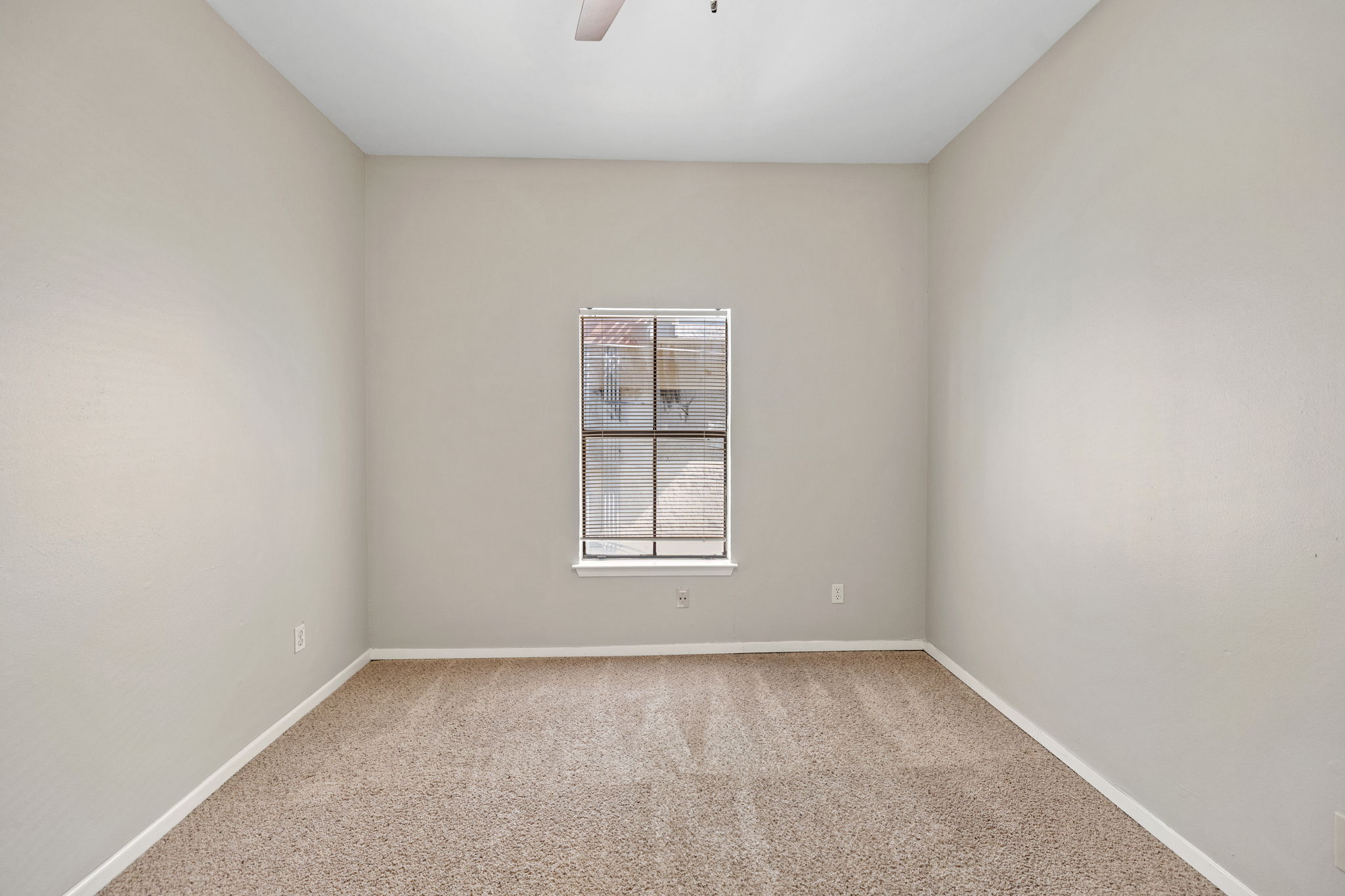 712 Graham Place, Unit 203 Austin, TX 78705 - Photo 16 of 30 an empty room with a window