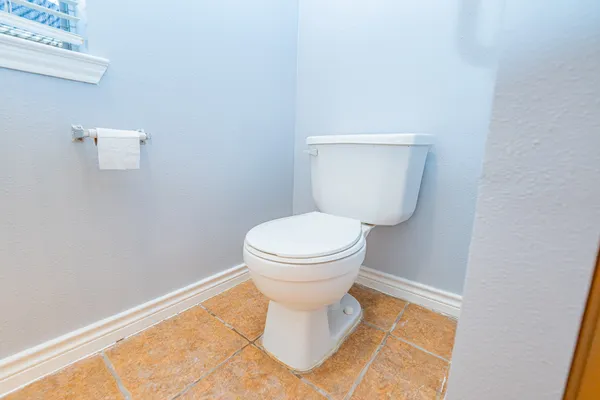 a bathroom with a toilet and a vanity