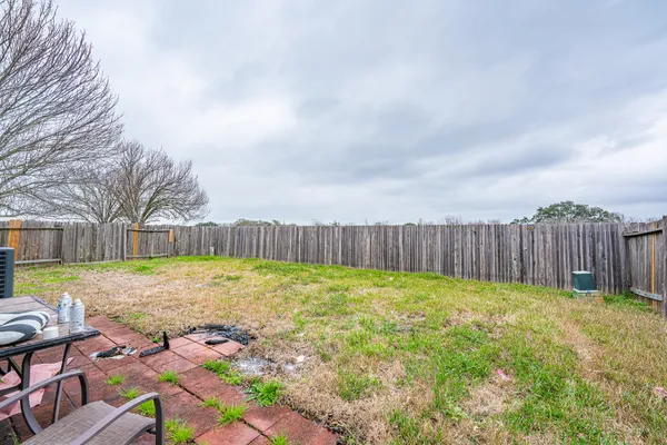 a view of backyard with trampoline
