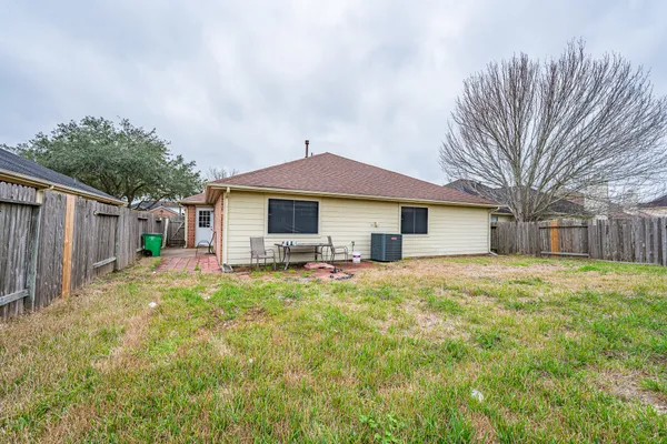 a house view with a backyard space