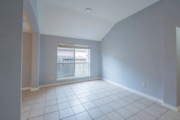 a view of an empty room and window