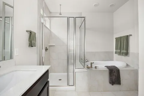 a bathroom with a bathtub and a sink