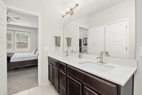 a en suite bathroom with a sink and a bathtub