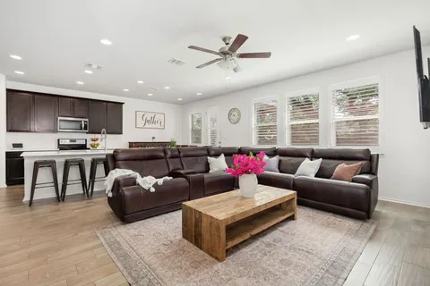 a living room with furniture and a large window
