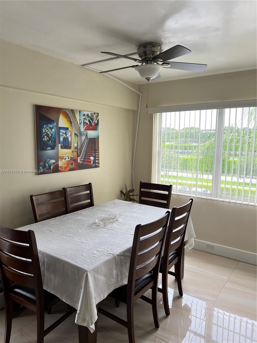 155 Suffolk F, Unit D Boca Raton, FL 33434 - Photo 22 of 41 a view of a dining room with furniture window and outside view