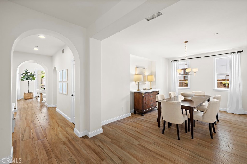 3 Tranquility Place Ladera Ranch, CA 92694 - Photo 10 of 63 a view of a dining room with furniture and wooden floor