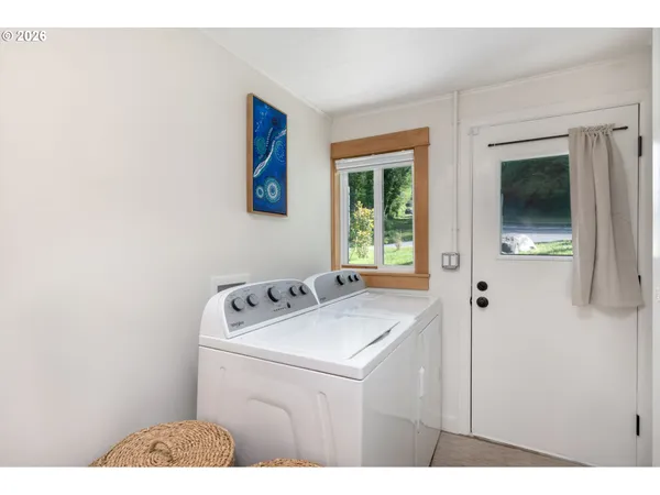 a utility room with dryer and washer