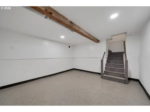 a view of an empty room with stairs