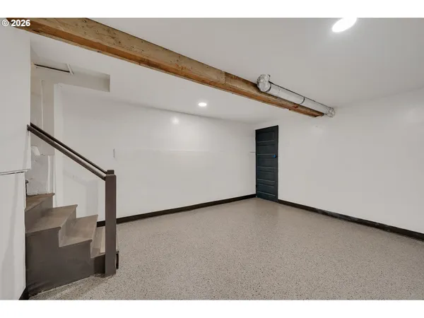 a view of a hallway with staircase