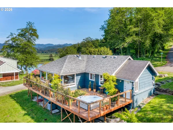 a aerial view of a house with table and chairs in a patio