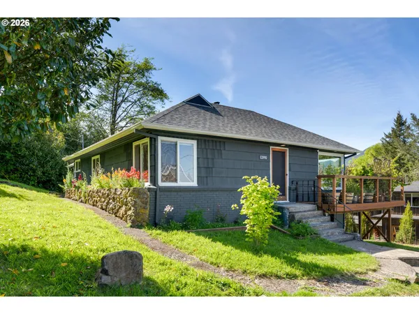 a view of a house with a garden