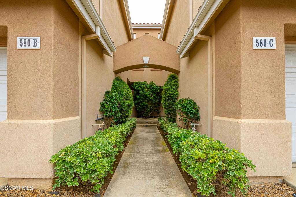 580 Fenwick Way, Unit C Simi Valley, CA 93065 - Photo 2 of 39 a front view of a house with a yard