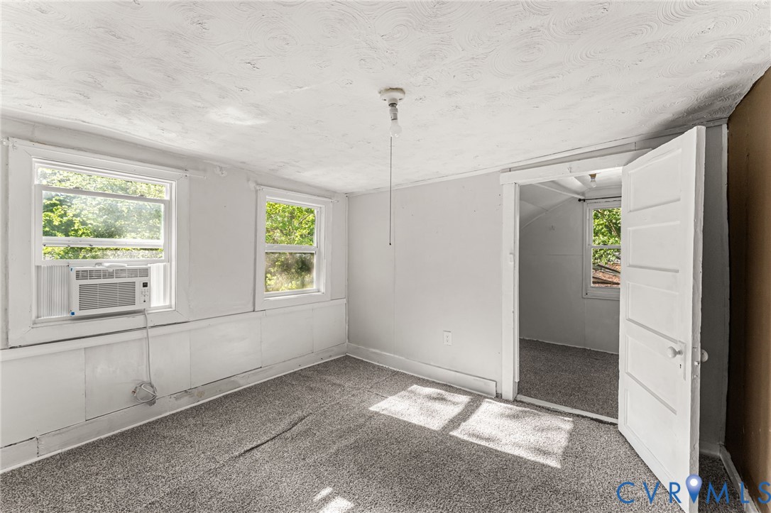 2097 Coles Point Road Hague, VA 22469 - Photo 26 of 34 a view of an empty room with window and cabinet area