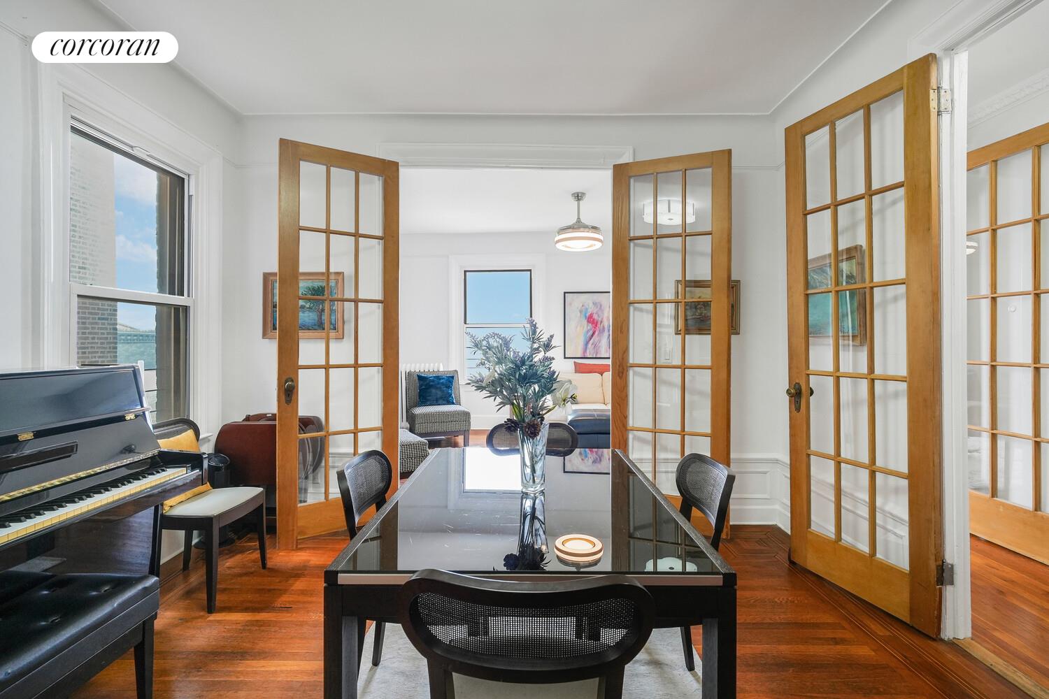 875 West 181st Street, Unit 4L Manhattan, NY 10033 - Photo 3 of 18 a view of a dining room with furniture window and wooden floor