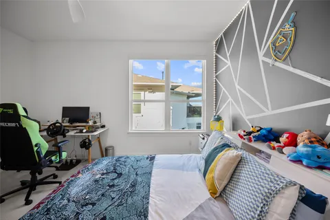 a bedroom with a bed and window