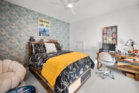 a bedroom with furniture and a window