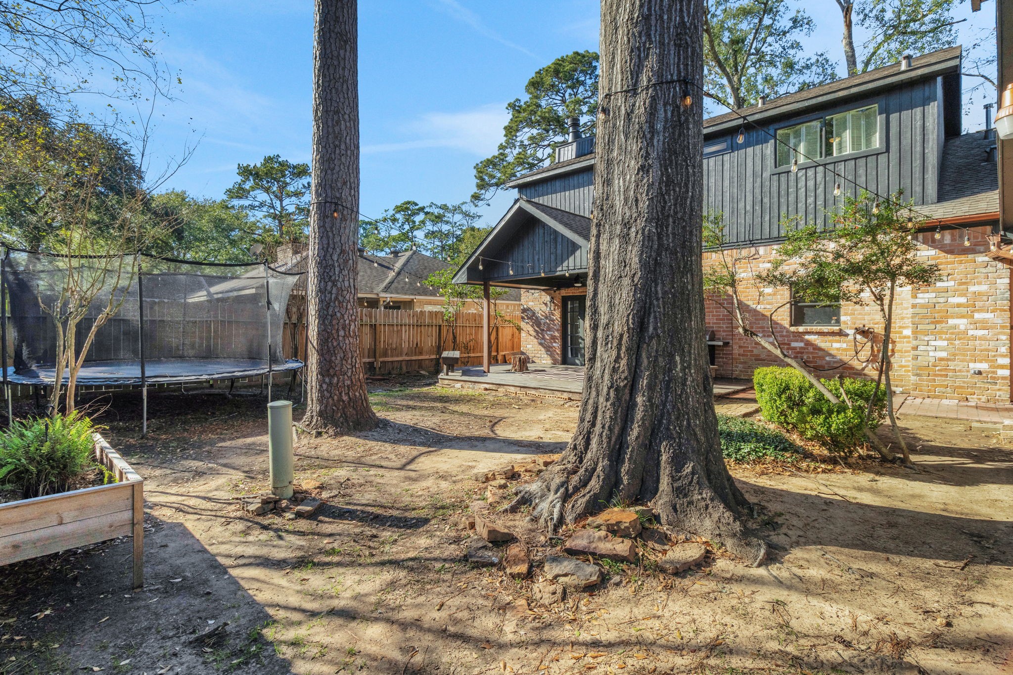 3627 Rolling Forest Drive Spring, TX 77388 - Photo 40 of 47 Mature trees and built-in garden box plus room for a playset or trampoline.