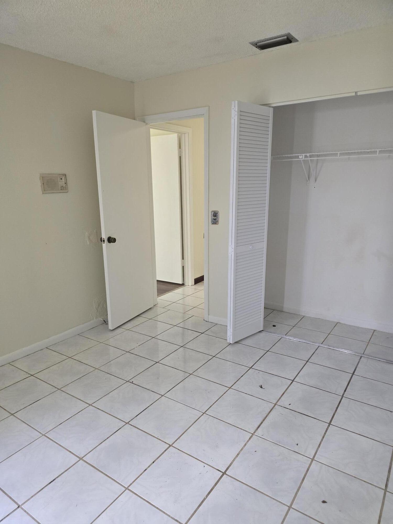 12730 Southwest 112th Street Miami, FL 33186 - Photo 6 of 11 a view of an empty room and room
