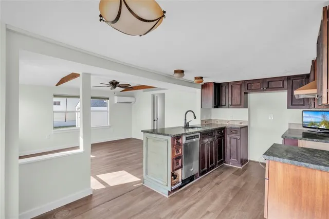 a kitchen with stainless steel appliances granite countertop a stove and a refrigerator