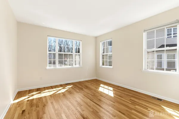 a view of empty room with windows