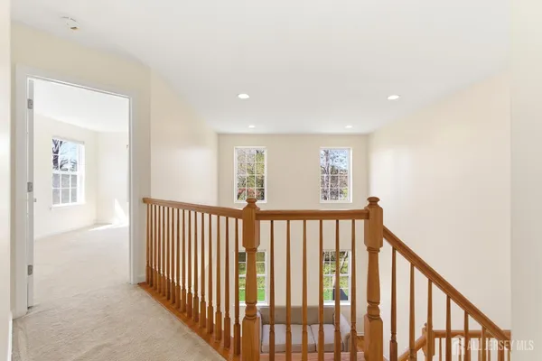 a view of a hallway with windows