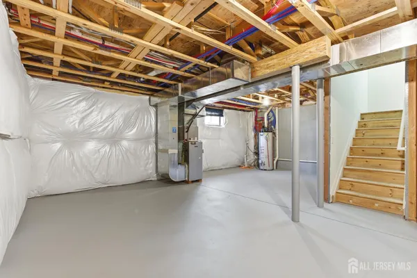 a view of an empty room with wooden walls