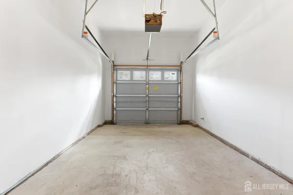 a view of a room with stairs and white walls