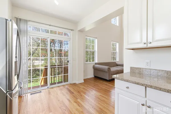 a view of a livingroom with furniture and wooden floor