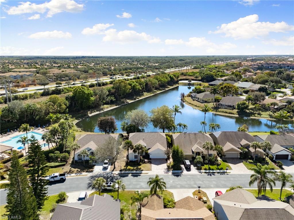 7867 Gardner Drive Naples, FL 34109 - Photo 28 of 36 Aerial perspective of suburban area with a nearby body of water