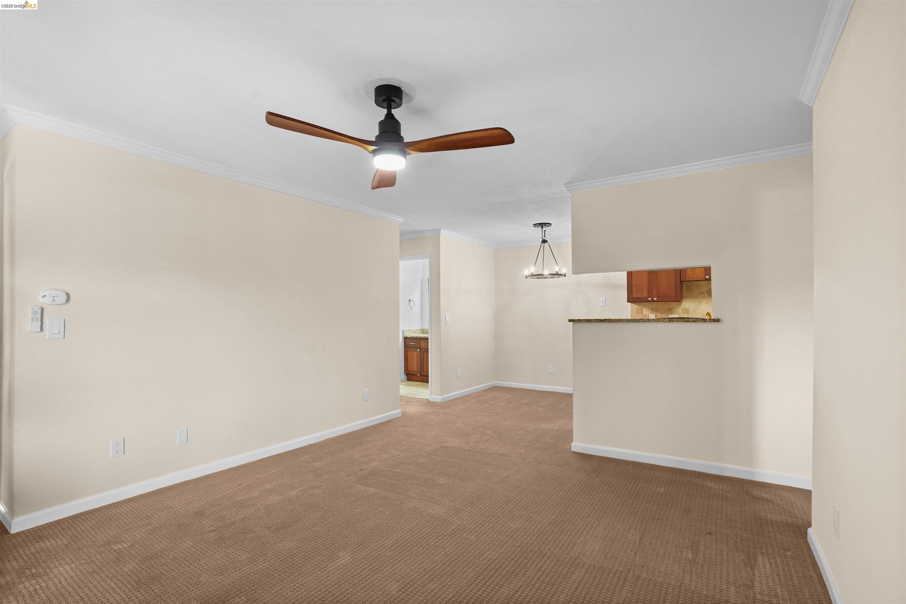 1505 Kirker Pass Road, Unit 214 Concord, CA 94521 - Photo 11 of 55 Carpeted living area featuring a ceiling fan with integrated lighting