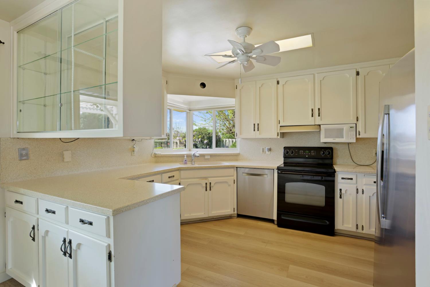 2465 Vernalis Road Tracy, CA 95304 - Photo 7 of 55 a kitchen with stainless steel appliances granite countertop a stove a sink and a refrigerator