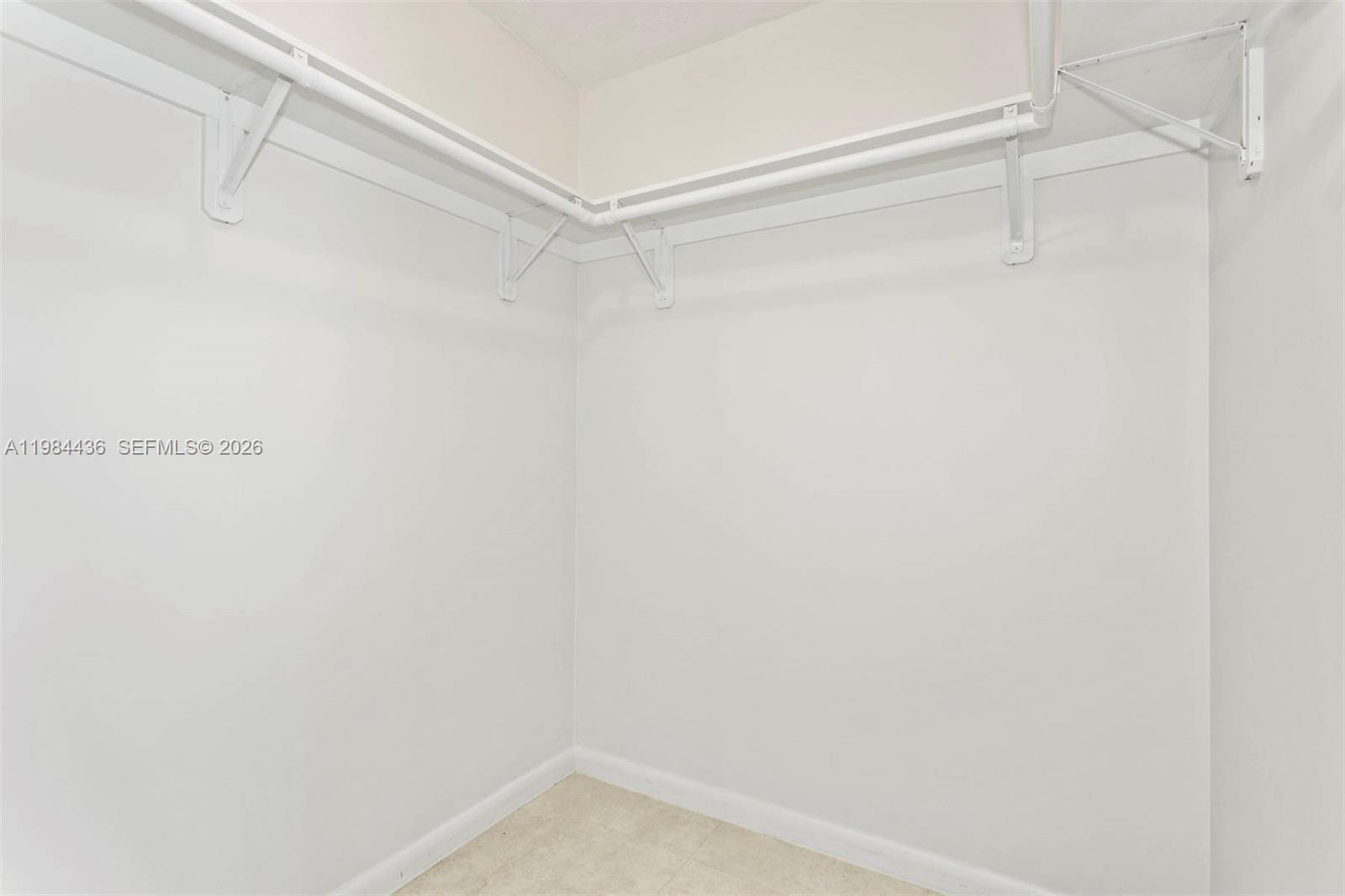 11807 Southwest 112th Avenue Miami, FL 33176 - Photo 11 of 48 a view of a room with racks on the wall