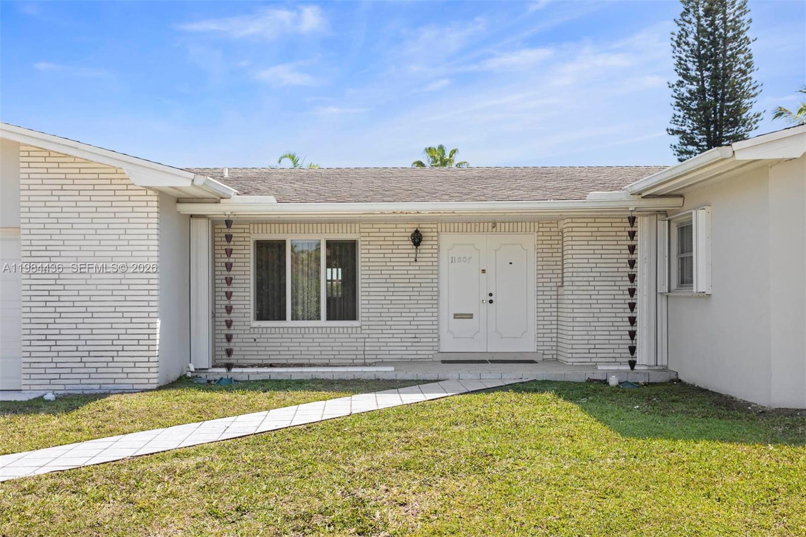 11807 Southwest 112th Avenue Miami, FL 33176 - Photo 2 of 48 a view of a house with backyard