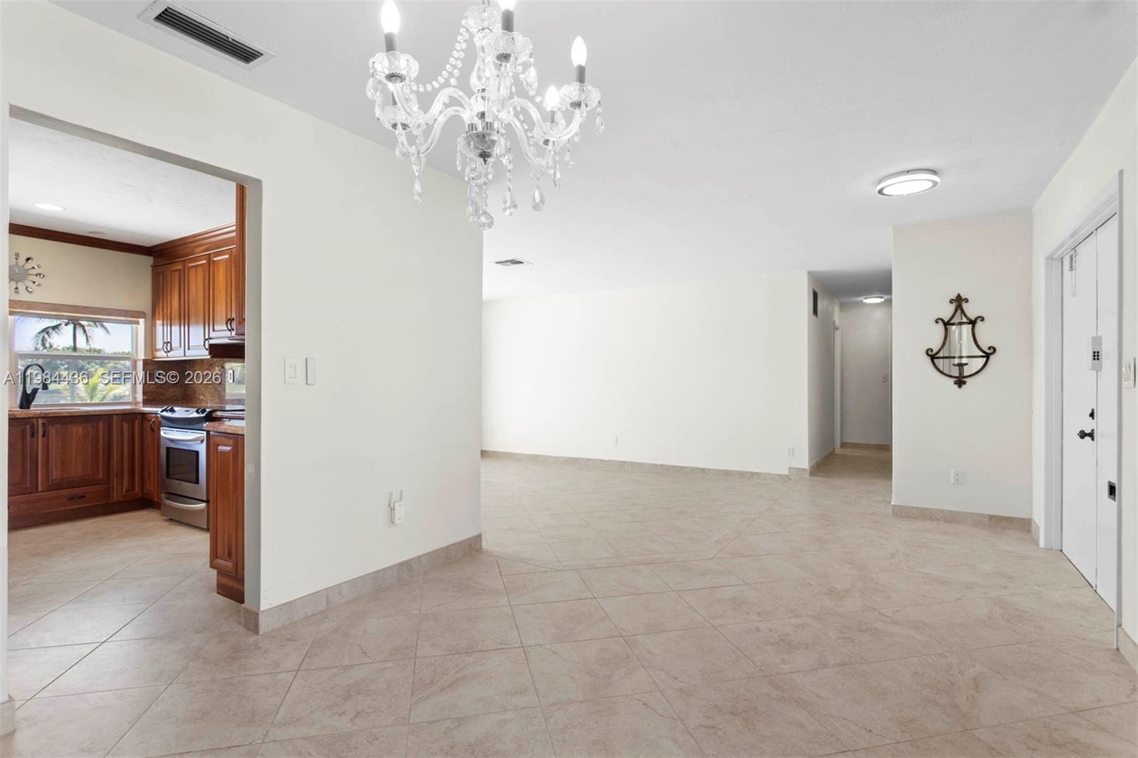 11807 Southwest 112th Avenue Miami, FL 33176 - Photo 22 of 48 a view of livingroom with kitchen
