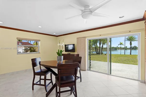 a dining room with furniture and front door