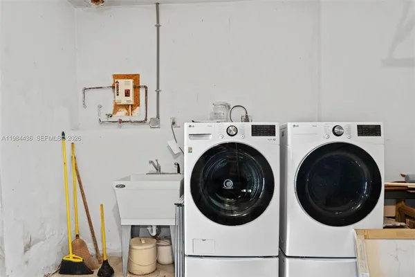 a view of a storage & utility room with a sink