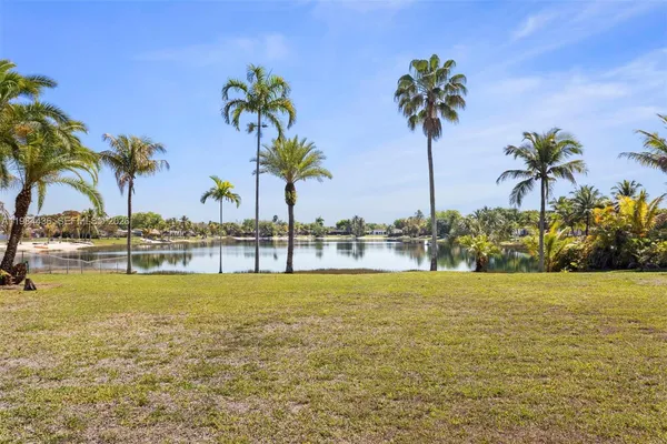 a view of an swimming pool with a garden