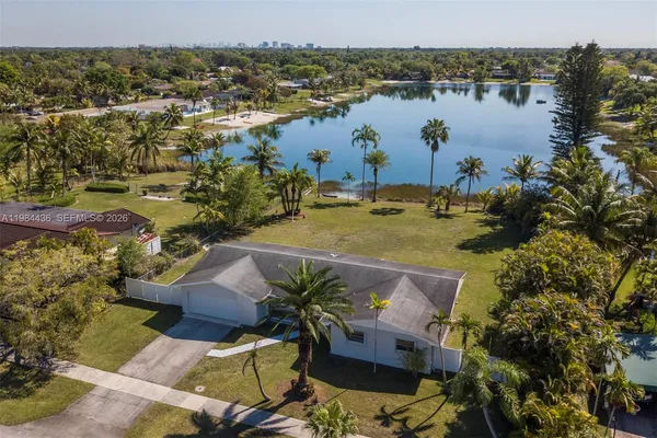 an aerial view of a house with a yard and garden